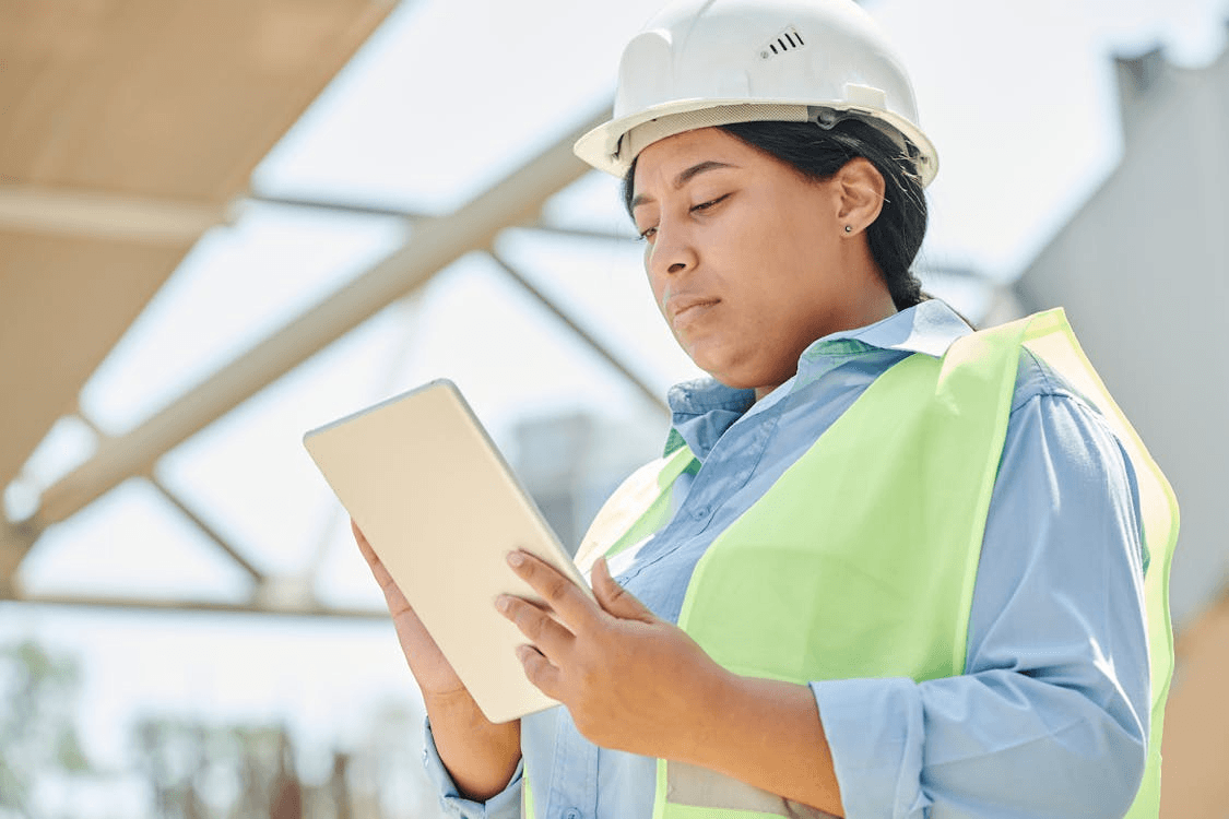 Site leader completing a checklist on a tablet